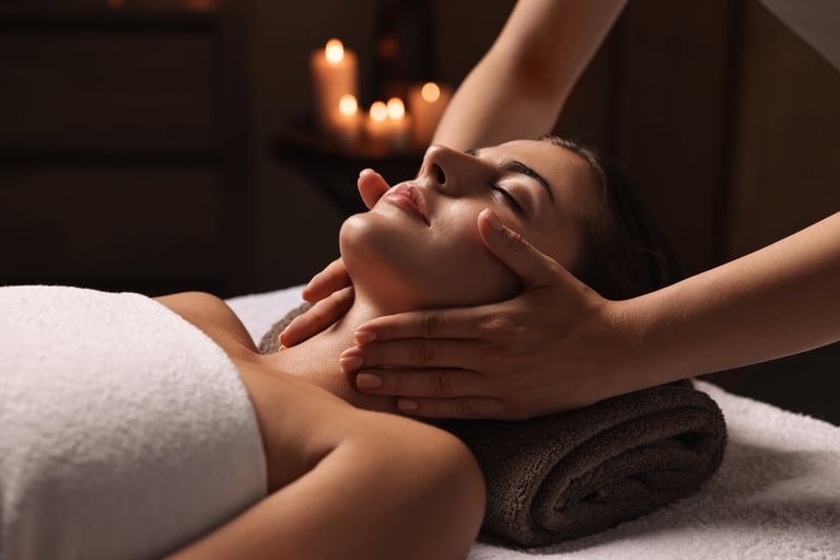 Woman enjoying face massage at spa beauty procedure